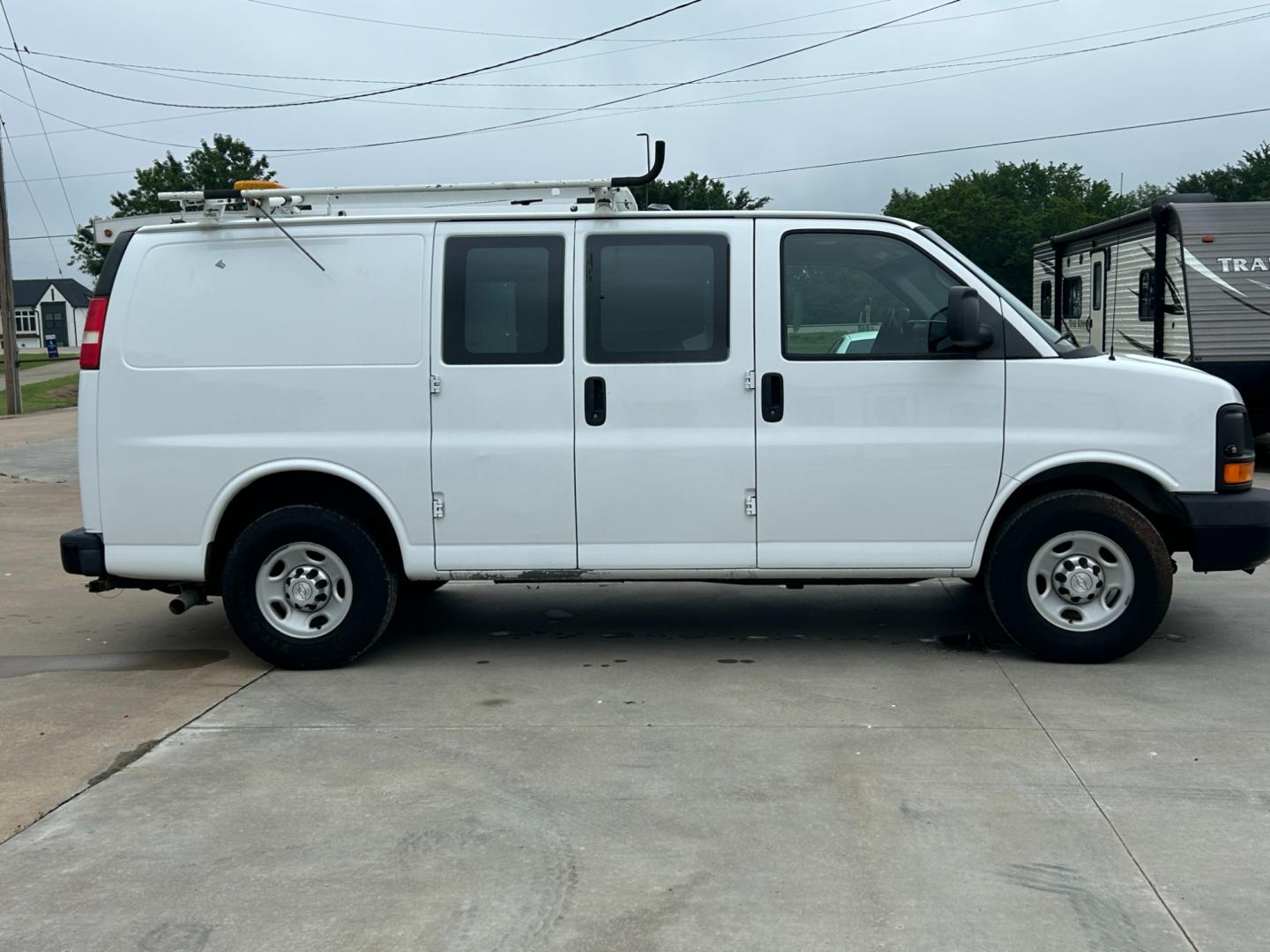 2014 White /Gray Chevrolet Express (1GCWGFCB5E1) , AUTOMATIC transmission, located at 17760 Hwy 62, Morris, OK, 74445, (918) 733-4887, 35.609104, -95.877060 - 2014 CHEVROLET EXPRESS CARGO VAN 6.0L V8 RWD FEATURING POWER LOCKS, POWER WINDOWS, MANUAL MIRRORS, MANUAL SEATS, AM/FM STEREO, LEATHER SEATS, LEATHER-WRAPPED STEERING WHEEL, TRACTION CONTROL, LOCKING METAL CONSOLE, STEEL SHELVES, SPLIT SWING-OUT RIGHT DOORS, AND TOW PACKAGE. EQUIPPED WITH A CNG FUE - Photo#3